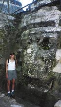 Anna and a giant head in Tikal